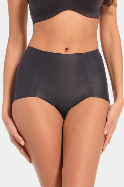 Person wearing black high-waisted underwear on a white background